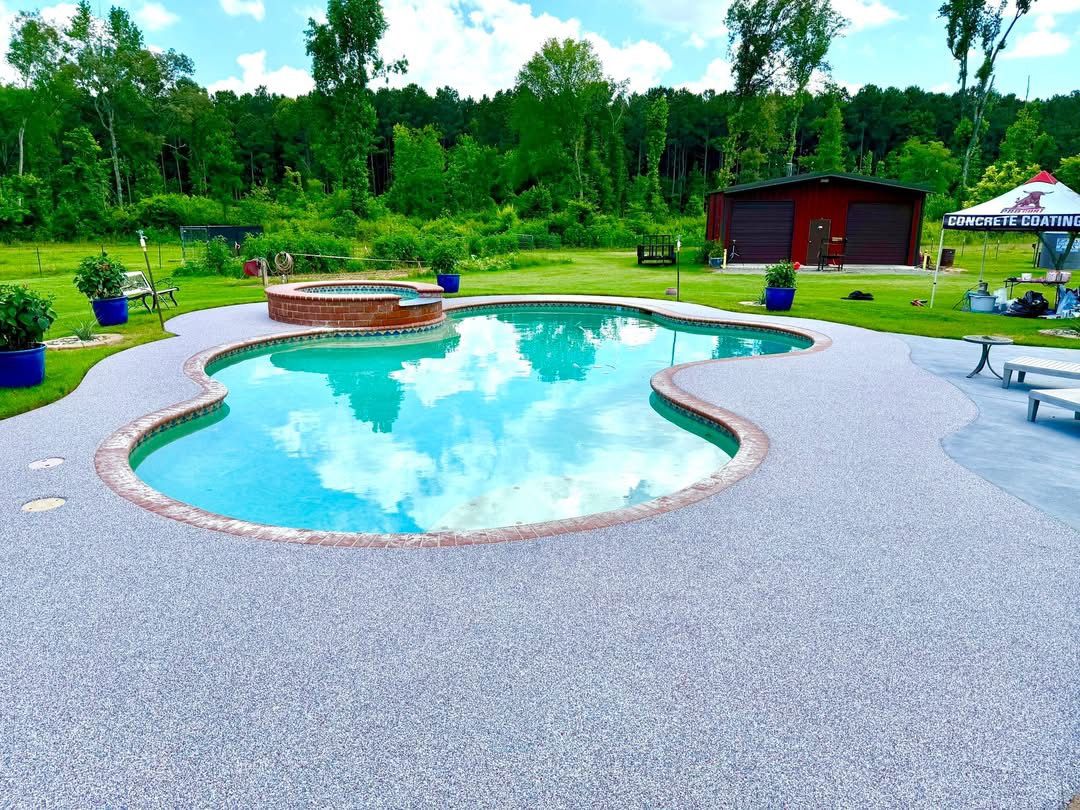 Finished kidney pool deck in gray speckled surfacing with a Pro Coat branded tent
