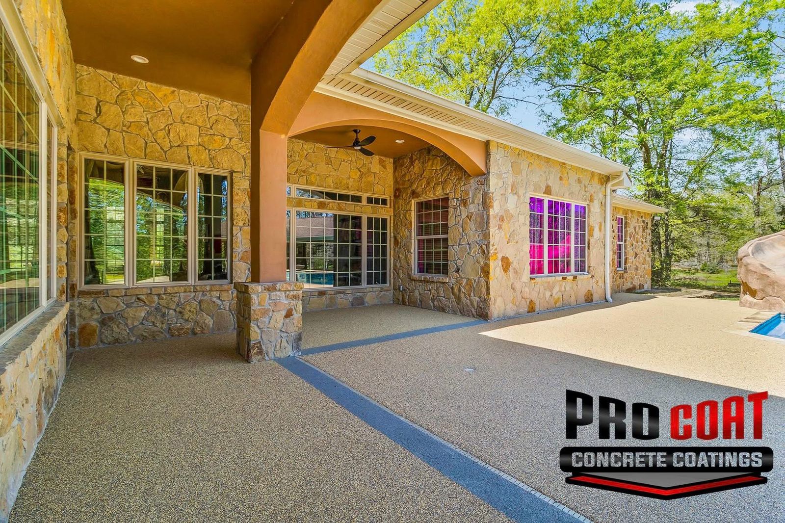 Pro Coat Concrete Coatings branded finished patio surrounding a home