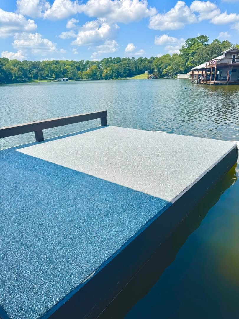 Finished lakeside dock surfaced in blue-gray Pro-Flex rubber surfacing