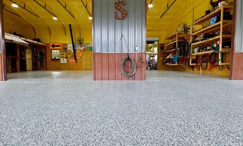 Large commercial workshop with tool storage finished with a gray speckled flake floor coating