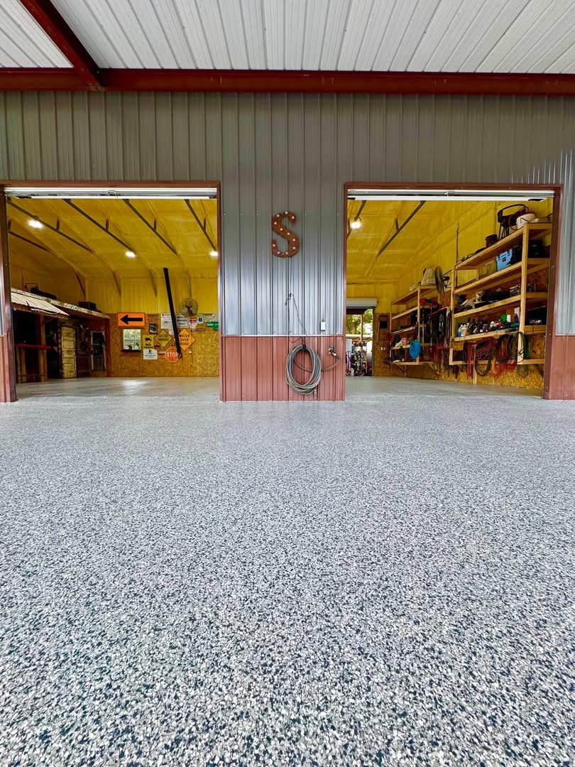 Workshop with tool storage bays finished in a gray speckled flake floor coating