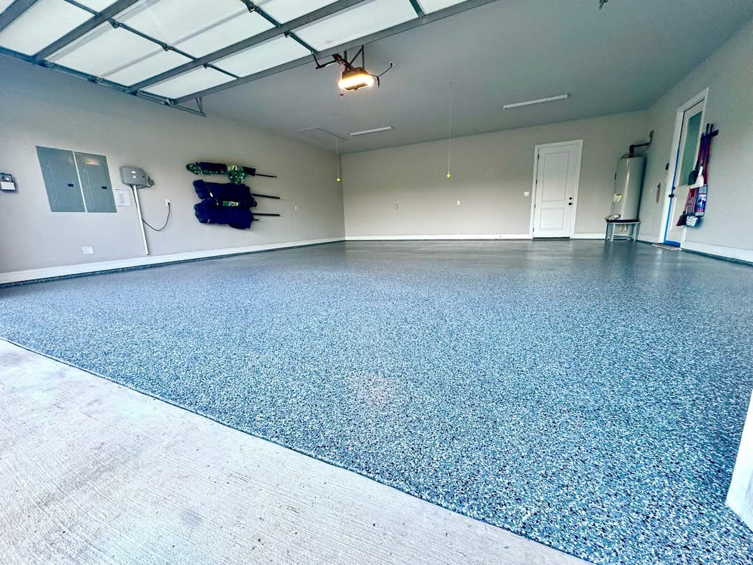 Bright modern garage finished with a blue-gray speckled flake floor coating
